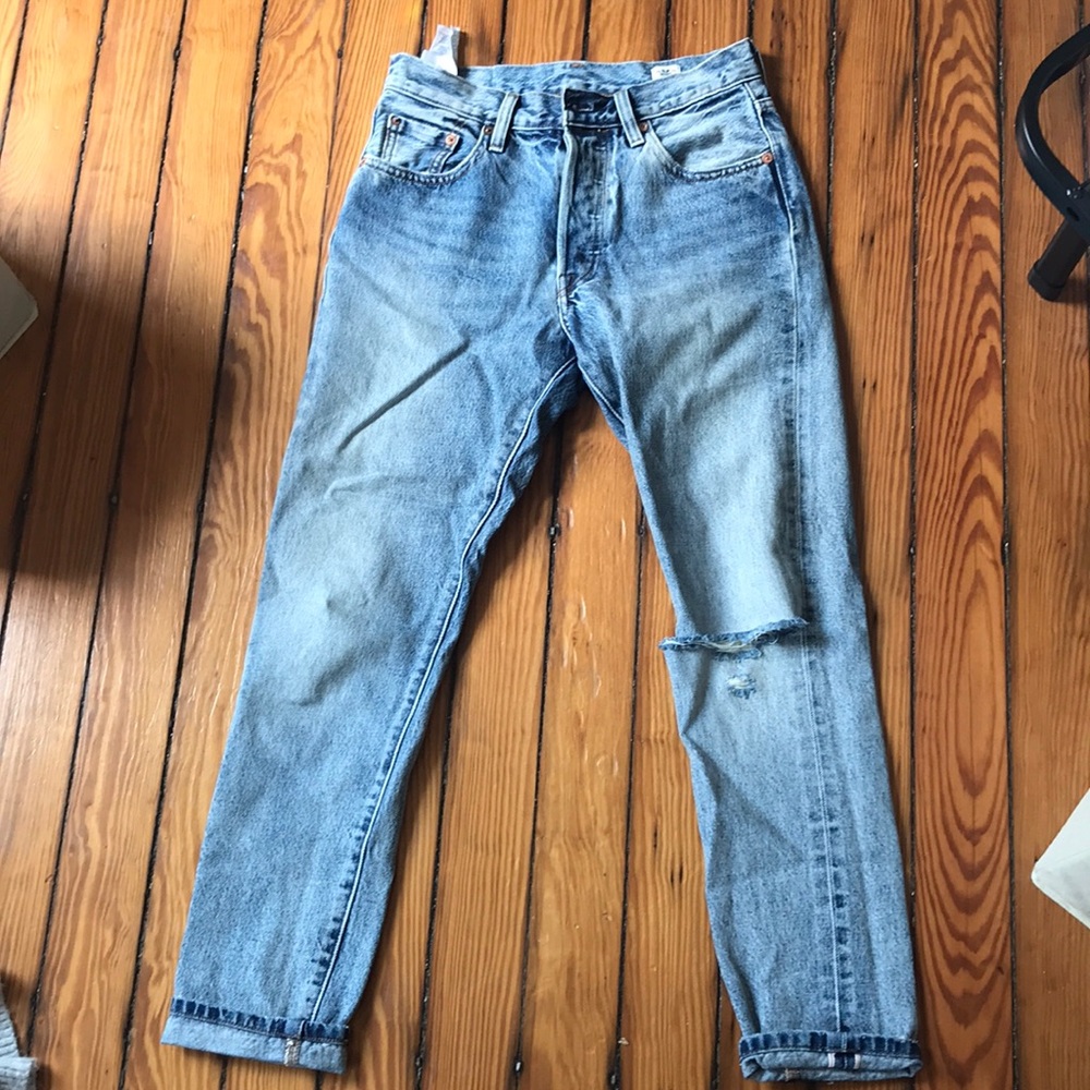 Levi’s 501s with distressed knee